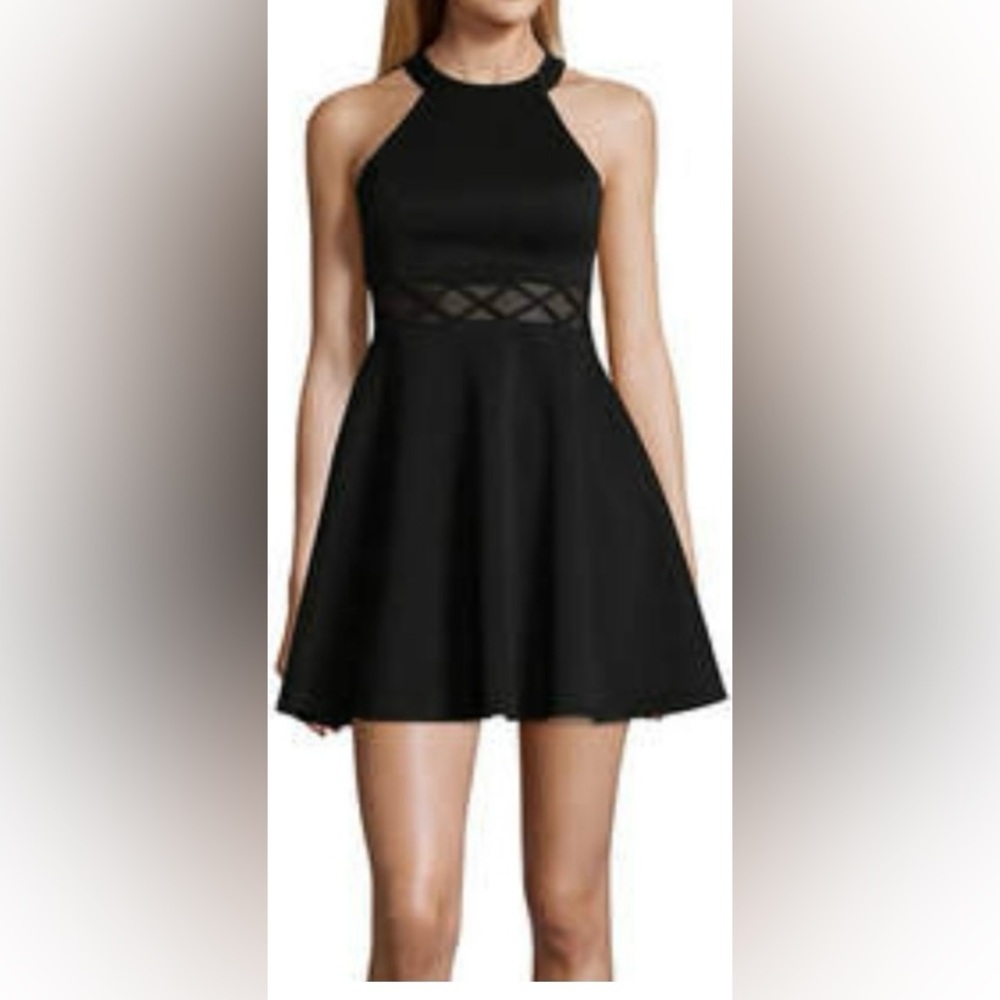 Sleeveless halter fit and flare glitter little black dress.